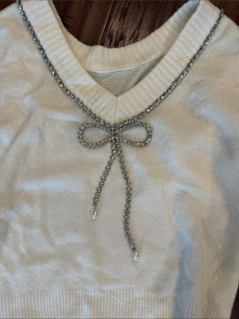 Express Cream Crewneck Sweater with Embellished back.